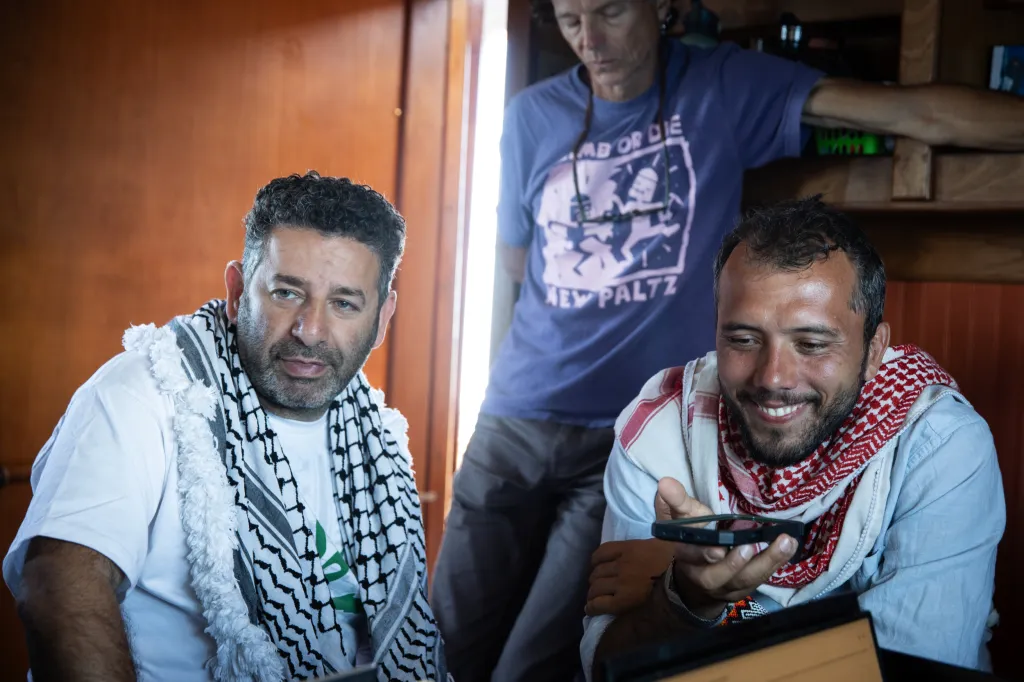 Saif Abukeshek and Thiago Ávila on board the Greenpeace vessel Arctic Sunrise.