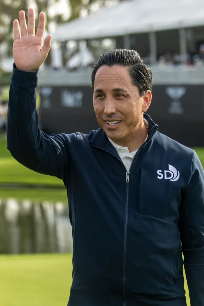 San Diego Mayor Todd Gloria waves to the crowd.