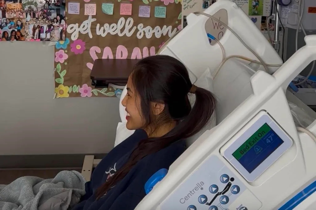 Sarah Danh in a hospital bed with a 