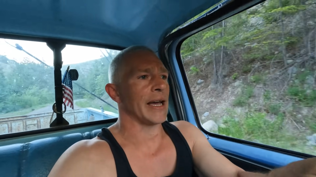 Matt Brown from Alaskan Bush People in a truck, looking concerned.