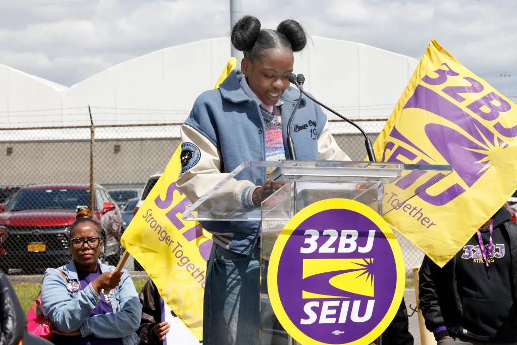 Shadequia Mercer, a former employee of Spirit Airlines , speaks to members of 32BJ SEIU during a rally at JFK Airport in New York on May 15, 2026.