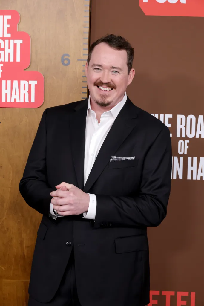 Shane Gillis smiling on the red carpet at The Roast of Kevin Hart.