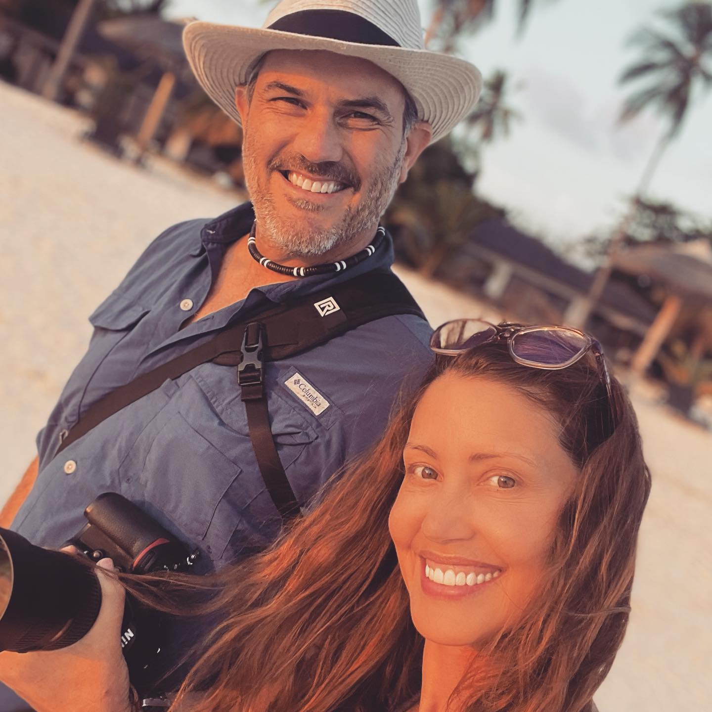 Shannon Elizabeth and her husband Simon Borchert smiling.