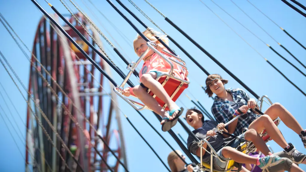 Children riding the Silly Symphony Swings at Disney California Adventure Park.