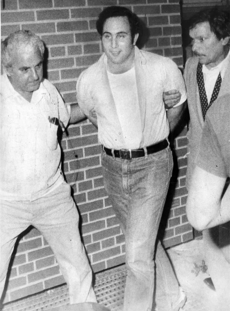 David Berkowitz (Son of Sam) smirks while being taken into custody.