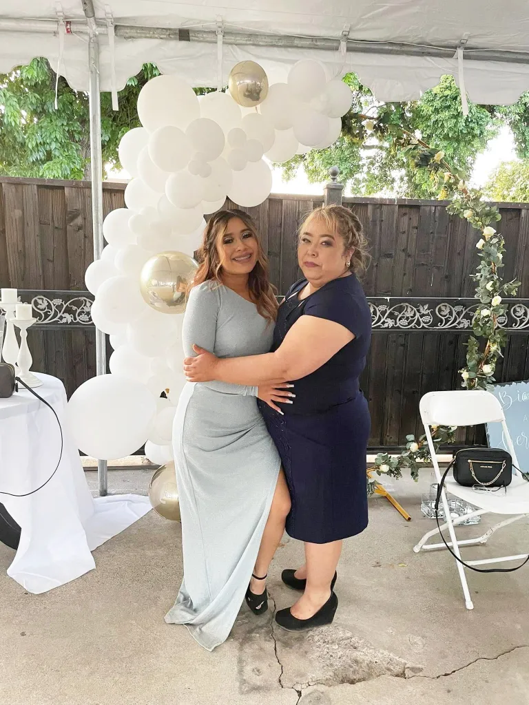 Silvia Nuñez Villalobos and Fabiola Gonzalez Nuñez pose together, embracing.
