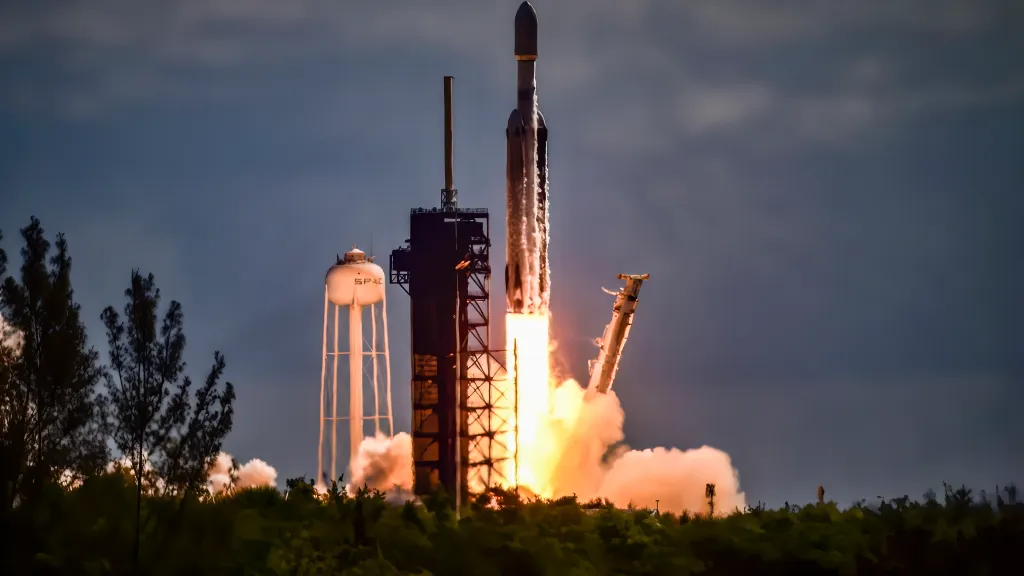 SpaceX Falcon Heavy rocket launching from Kennedy Space Center.