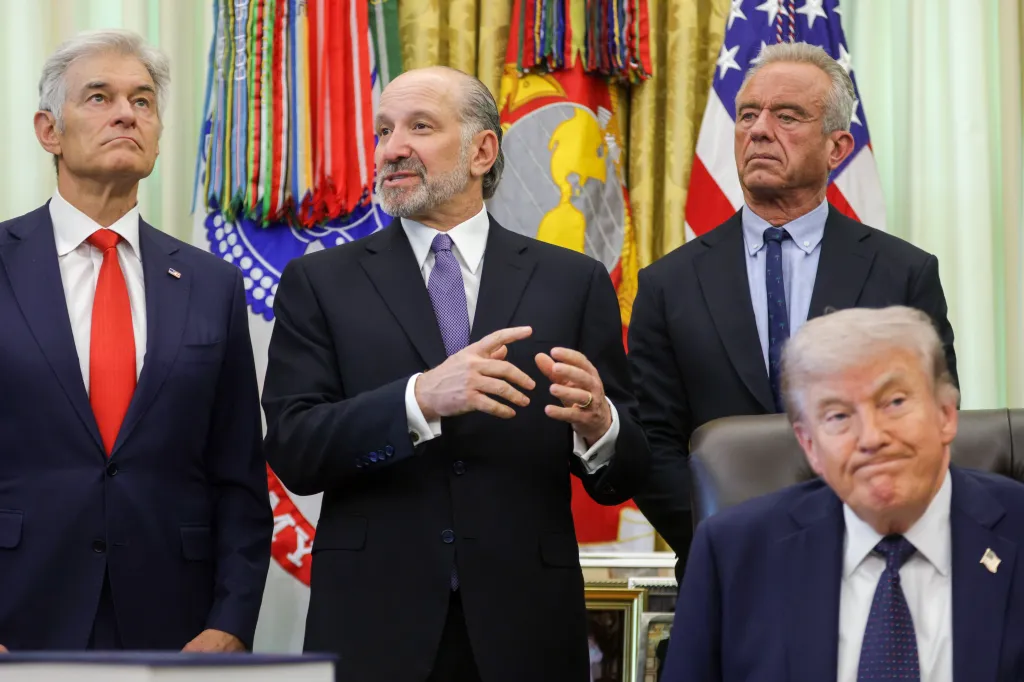 US Commerce Secretary Howard Lutnick speaks while Centers for Medicare & Medicaid Services Administrator Dr. Mehmet Oz, US Secretary of Health and Human Services Robert F. Kennedy Jr., and President Donald Trump look on during an event in the Oval Office.