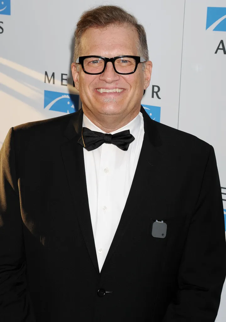 Drew Carey smiling in a black tuxedo and bow tie at the Mercy For Animals 15th Anniversary Gala.