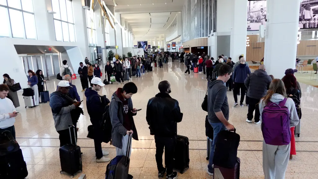 Thousands of passengers wait in line for TSA security screening in Terminal B at LaGuardia Airport.