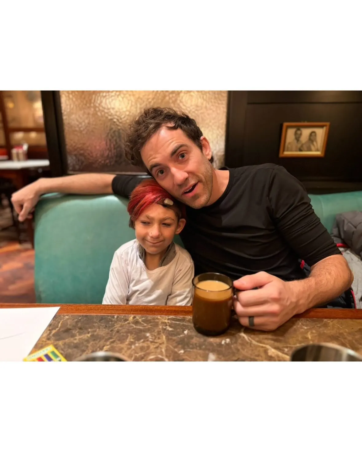 Daniel Coleman and his son Isaac at a restaurant.