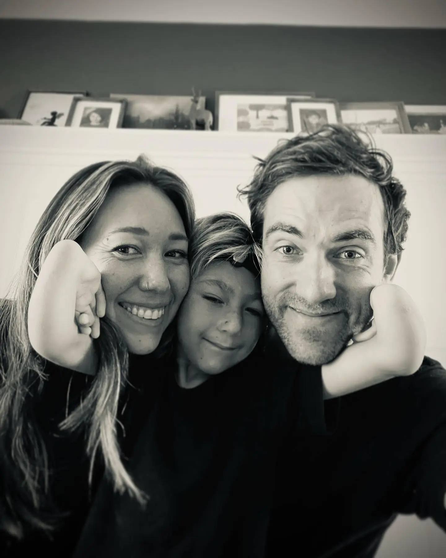 Black and white photo of Mindy and Daniel Coleman with their son Isaac.