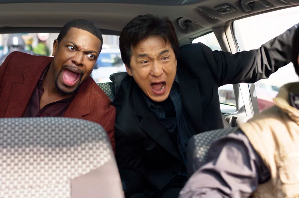 Chris Tucker as Carter and Jackie Chan as Inspector Lee in Rush Hour 3, both screaming inside a car.