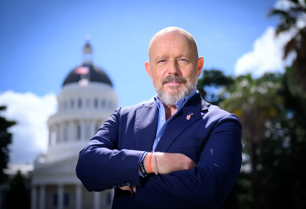 Steve Hilton, Republican gubernatorial candidate for California, poses in front of the California State Capitol building.