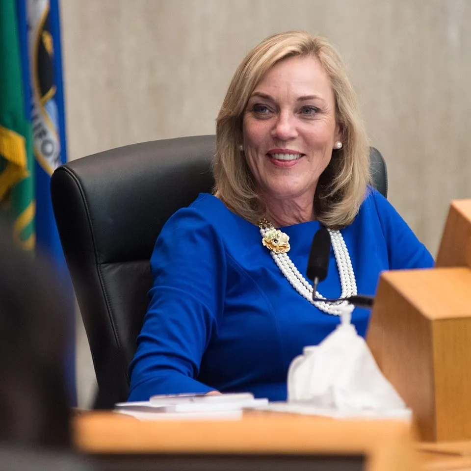 Supervisor Kathryn Barger in a blue dress and pearl necklace.