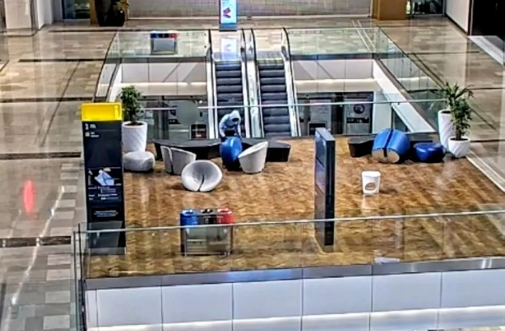 CCTV footage of a teen throwing a 15kg sofa from a shopping center balcony.
