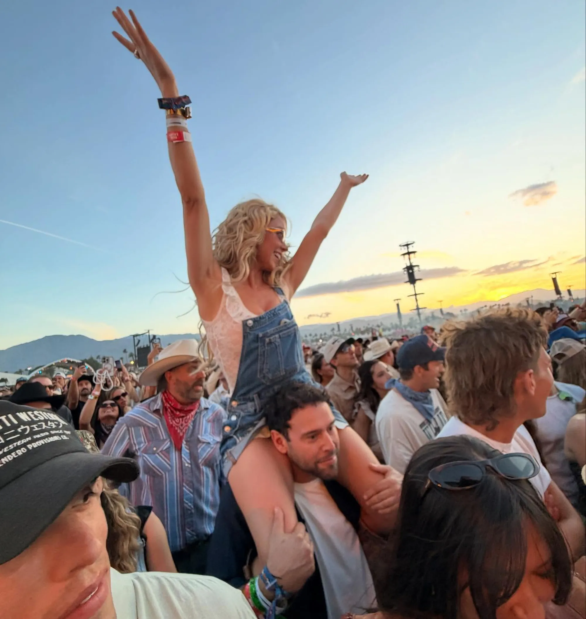 Sydney Sweeney on Scooter Braun's shoulders at Stagecoach.