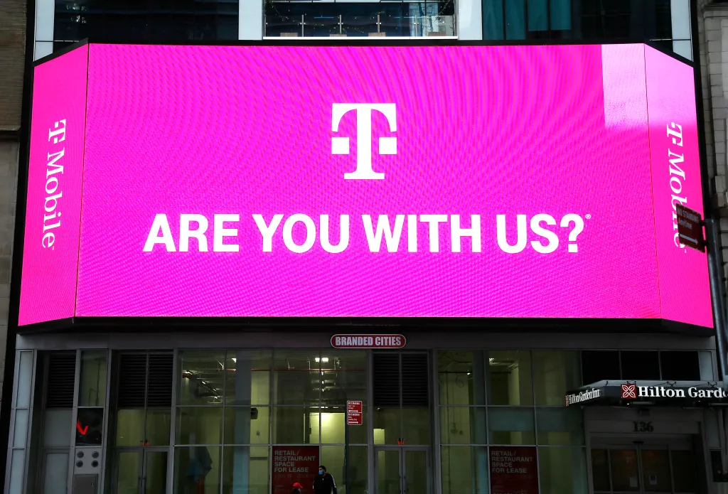 A T-Mobile advertisement on a large digital billboard in Times Square displaying