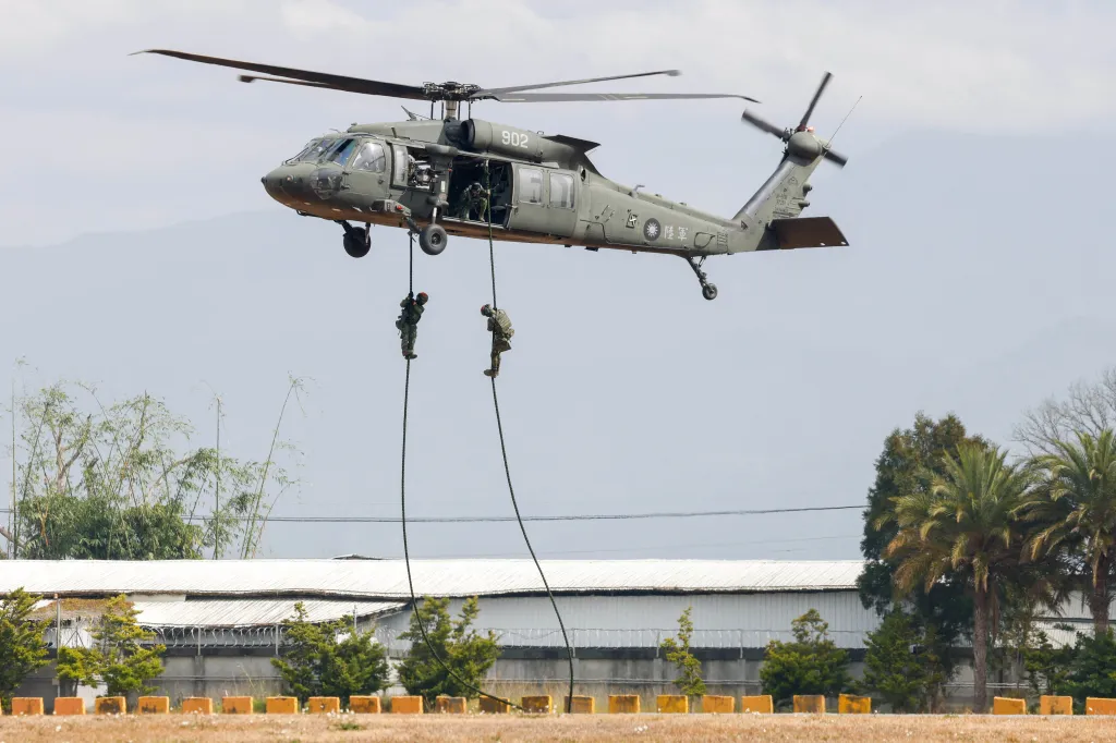 Taiwanese army soldiers rappelling from a UH-60 Black Hawk helicopter.