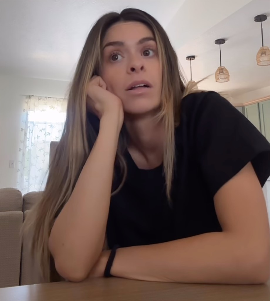 Taylor Frankie Paul looking nervous, with her chin resting in her hand.