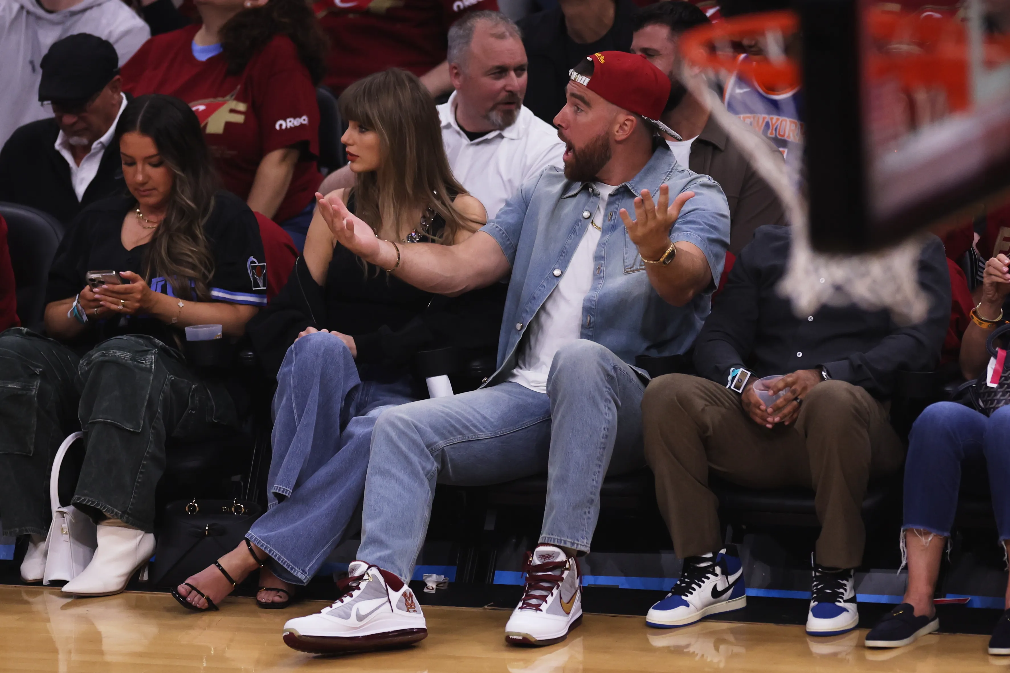 Taylor Swift and Travis Kelce watch the NBA basketball playoffs.