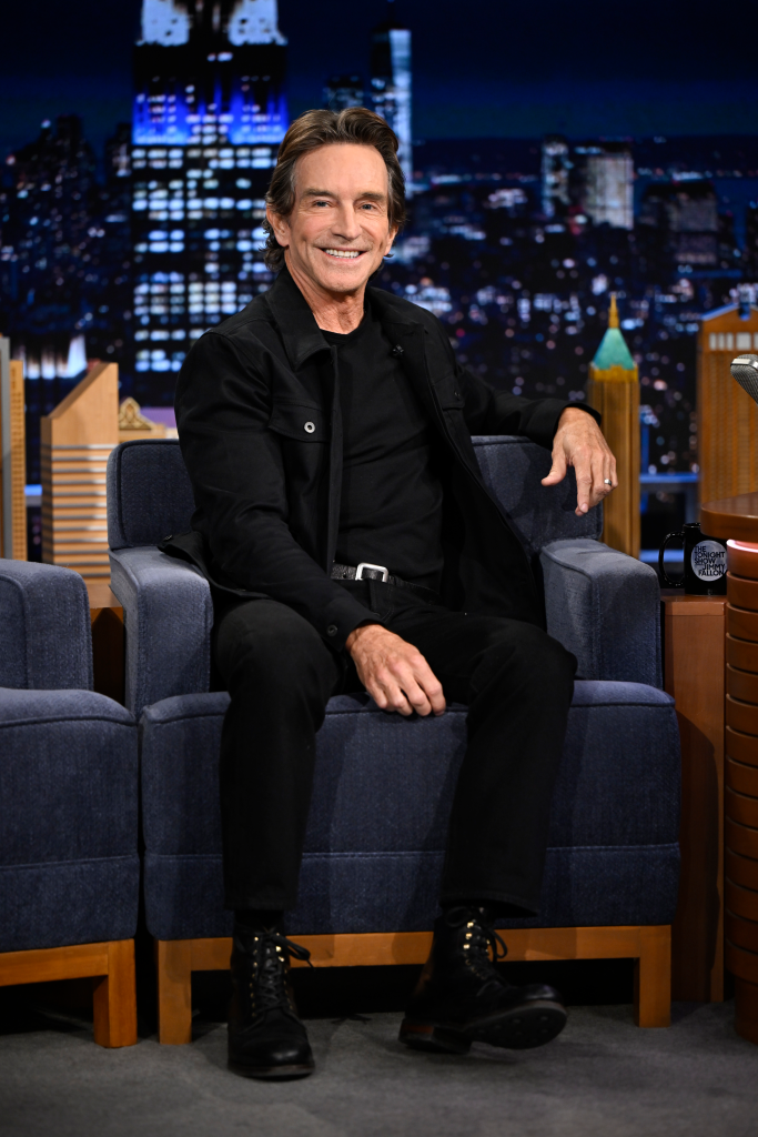 Television presenter Jeff Probst smiles while seated during an interview.