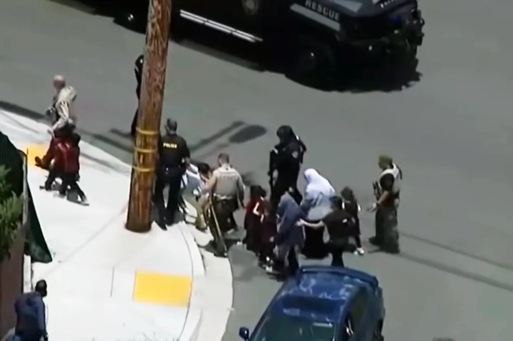 Children being evacuated from San Diego's Islamic Center.