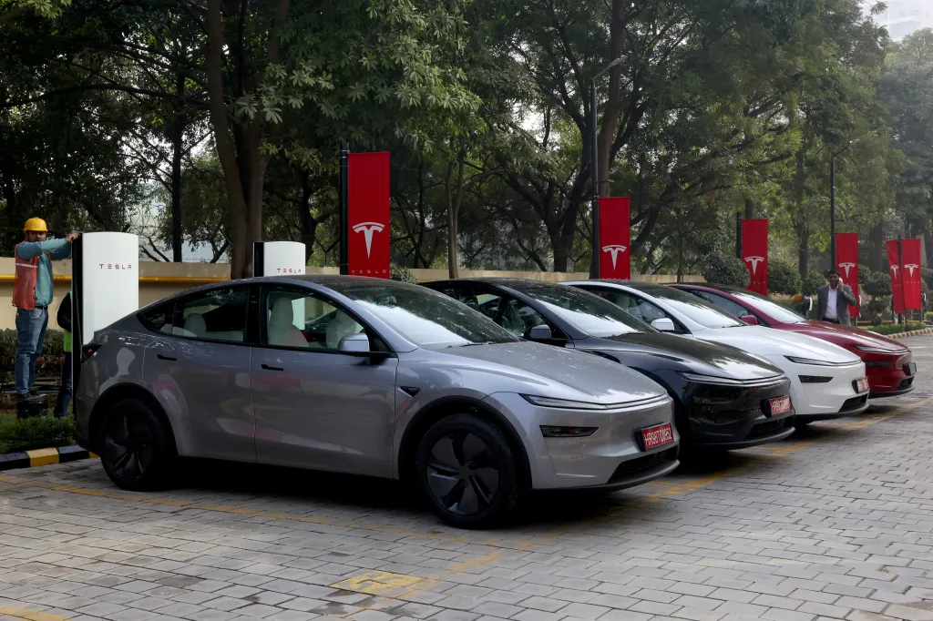 Tesla Model Y cars parked outside the new Tesla center in Gurugram, India.