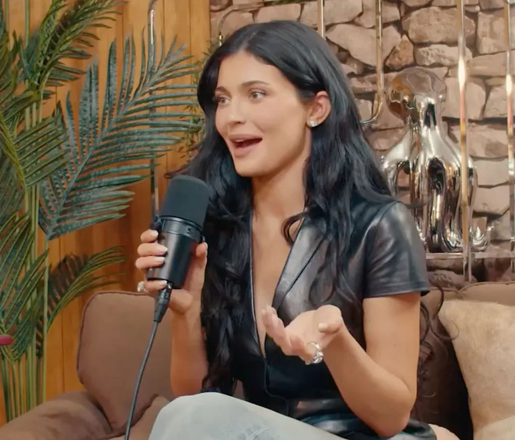 Kylie Jenner speaking into a microphone.