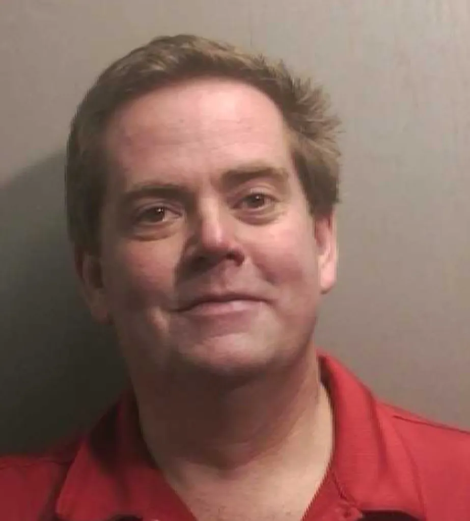 Mugshot of Thomas O’Donnell, a white man with short brown hair, wearing a red polo shirt, smiling slightly.