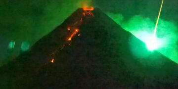 A Fiery Visitor From Space Photo-Bombs an Erupting Volcano