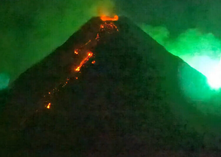 A Fiery Visitor From Space Photo-Bombs an Erupting Volcano