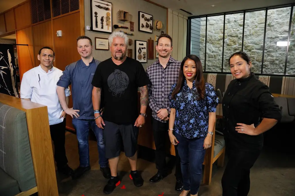 Thy and Matthew Mitchell pictured with Guy Fieri.