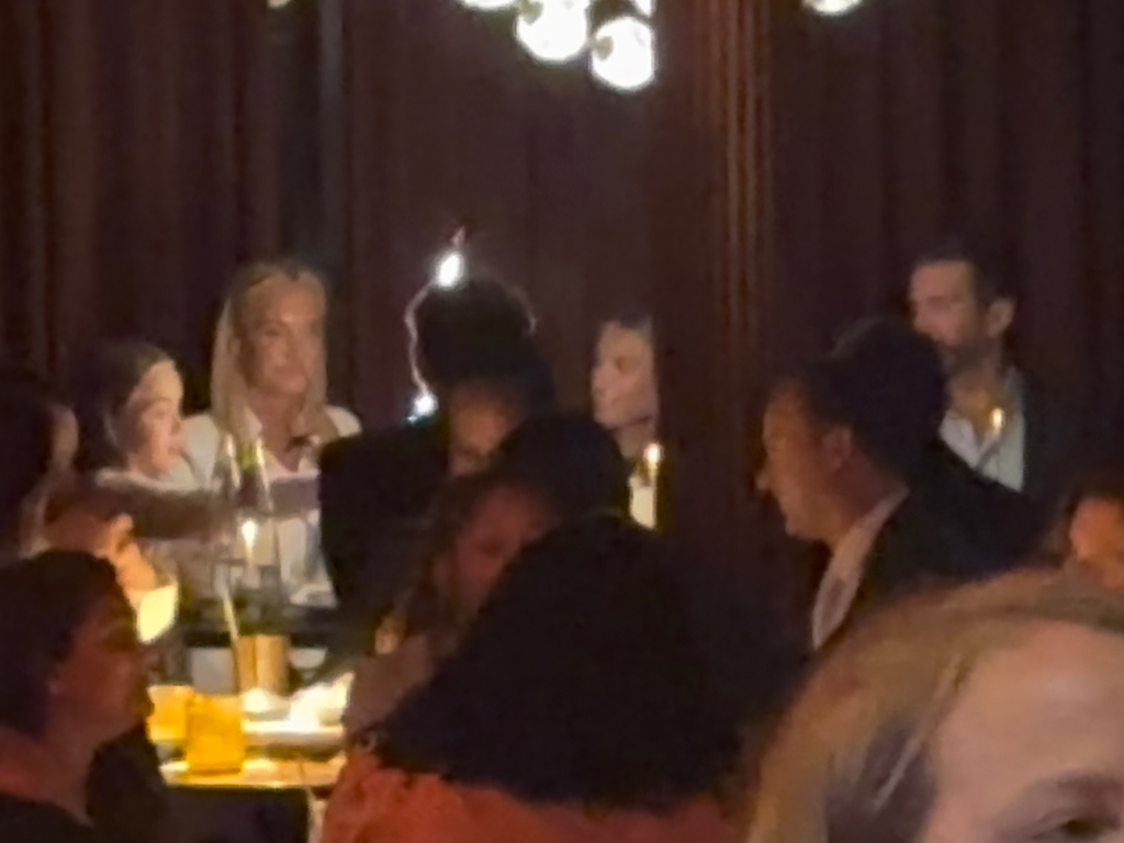Kai Trump, Donald Trump Jr., Vanessa Trump, and Tiffany Trump celebrating Kai's high school graduation at a restaurant.