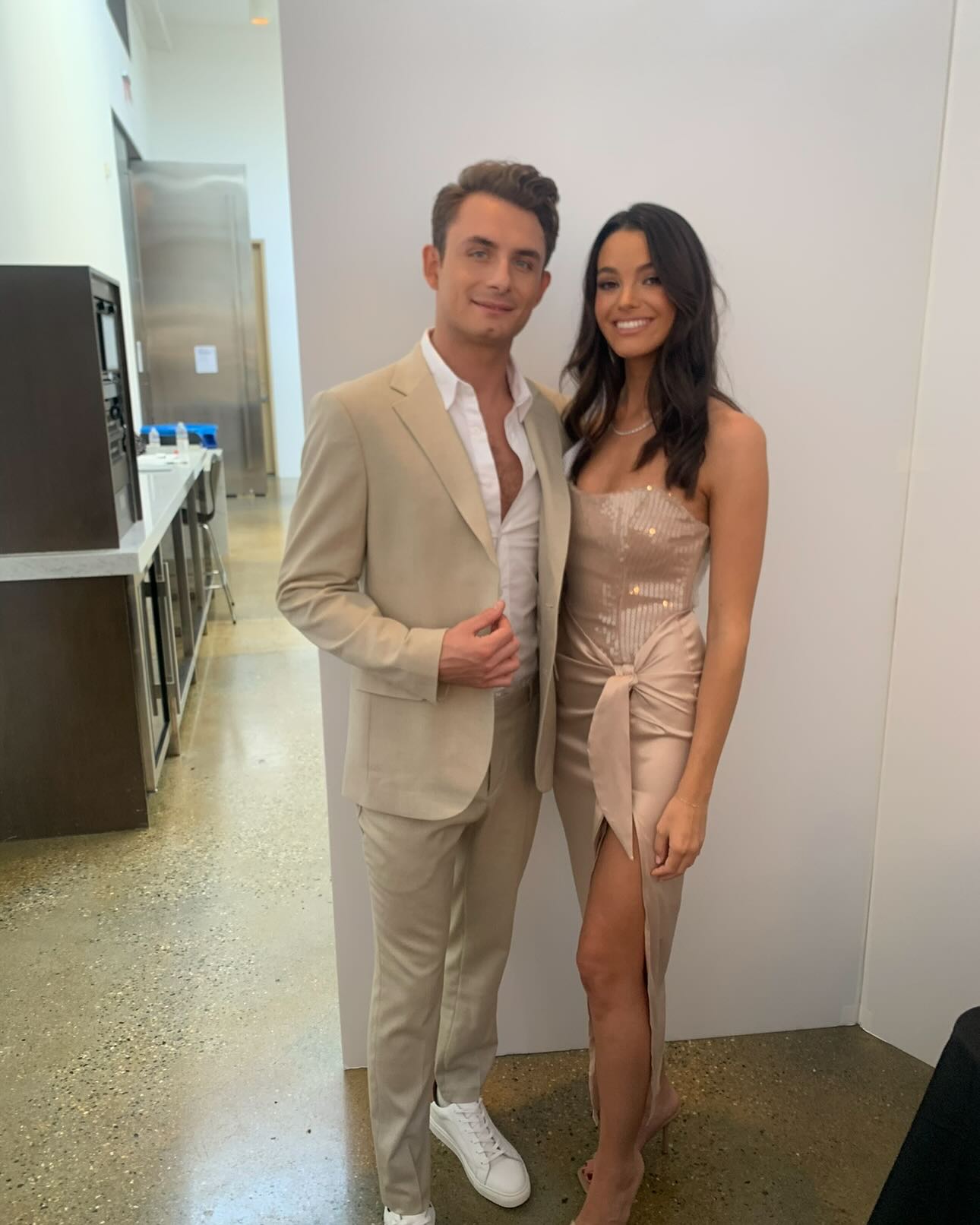 Ally Lewber and James Kennedy smiling at the camera.