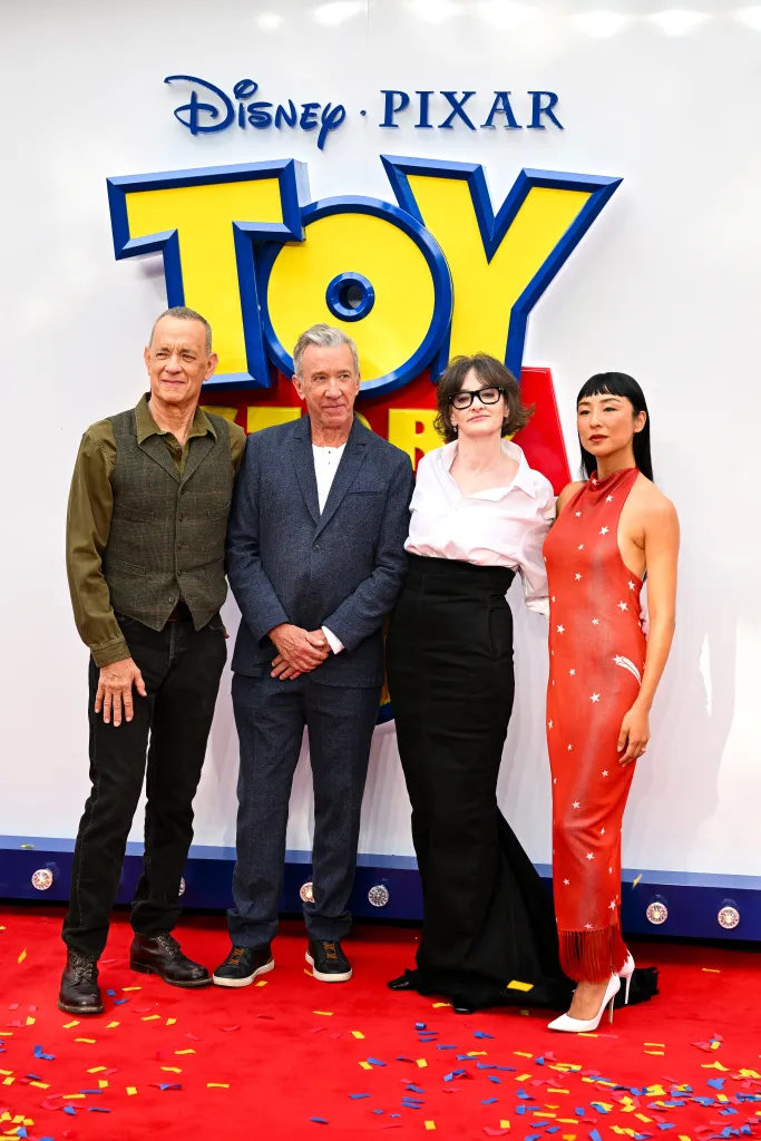 Tom Hanks, Tim Allen, Joan Cusack, and Greta Lee posing at the 