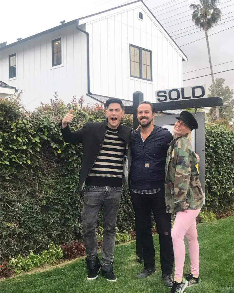 Tom Sandoval, Ariana Madix, and one other person standing in front of a white house with a 