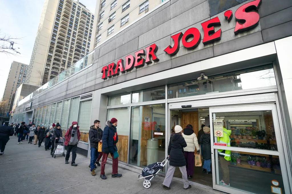 A line of shoppers outside of a Trader Joe's grocery store in Manhattan.