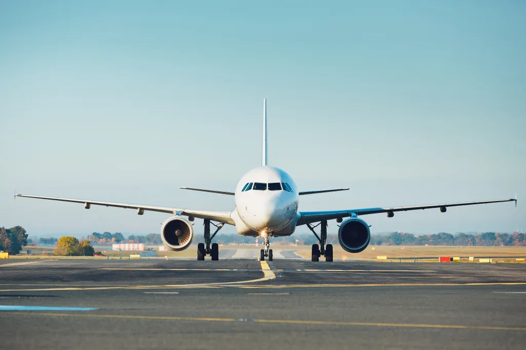 Passenger plane taxiing on the runway.