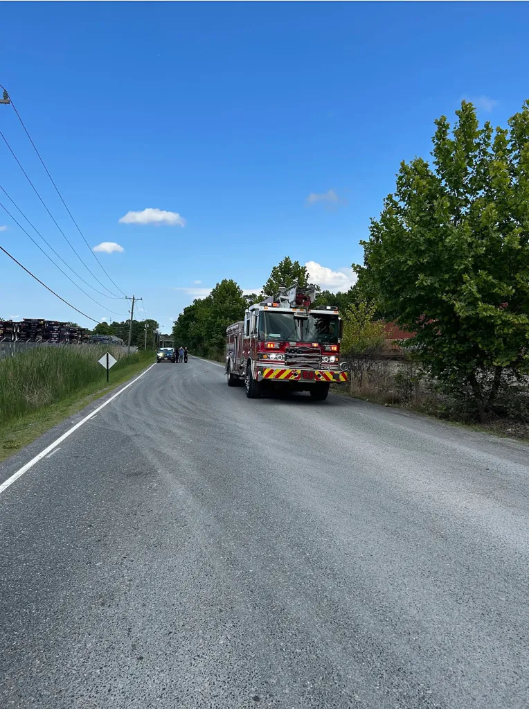A photo of a firetruck at the scene. 