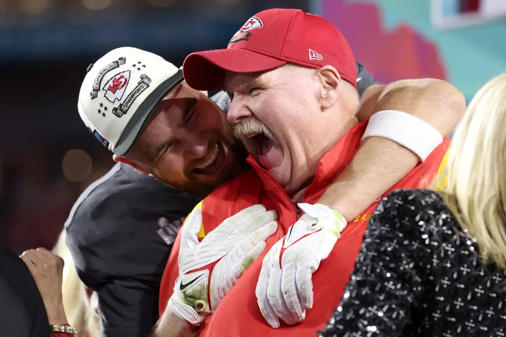 Travis Kelce #87 and head coach Andy Reid of the Kansas City Chiefs celebrate their Super Bowl LVII victory.