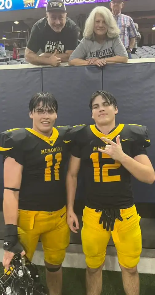 Austin Metcalf and his twin brother, Hunter, after a Memorial High School football game.