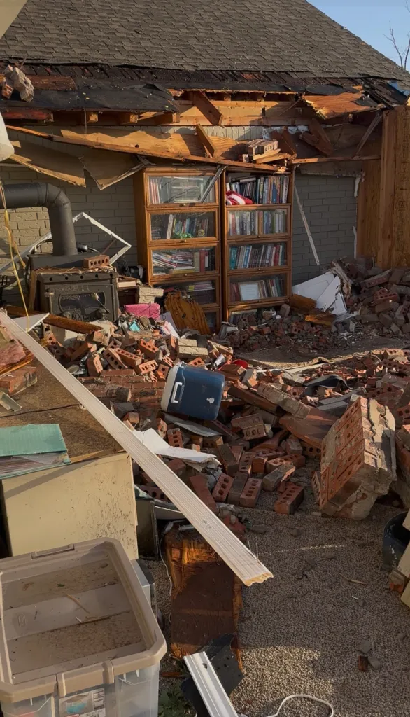 Debris and overturned furniture left after a tornado tore through the Sloat family's home