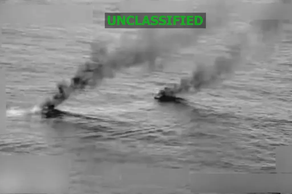 Two smoking vessels on the water with 