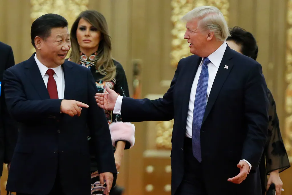 President Donald Trump and first lady Melania Trump are greeted by Chinese President Xi Jinping at the start of a state dinner at the Great Hall of the People on Nov. 9, 2017.