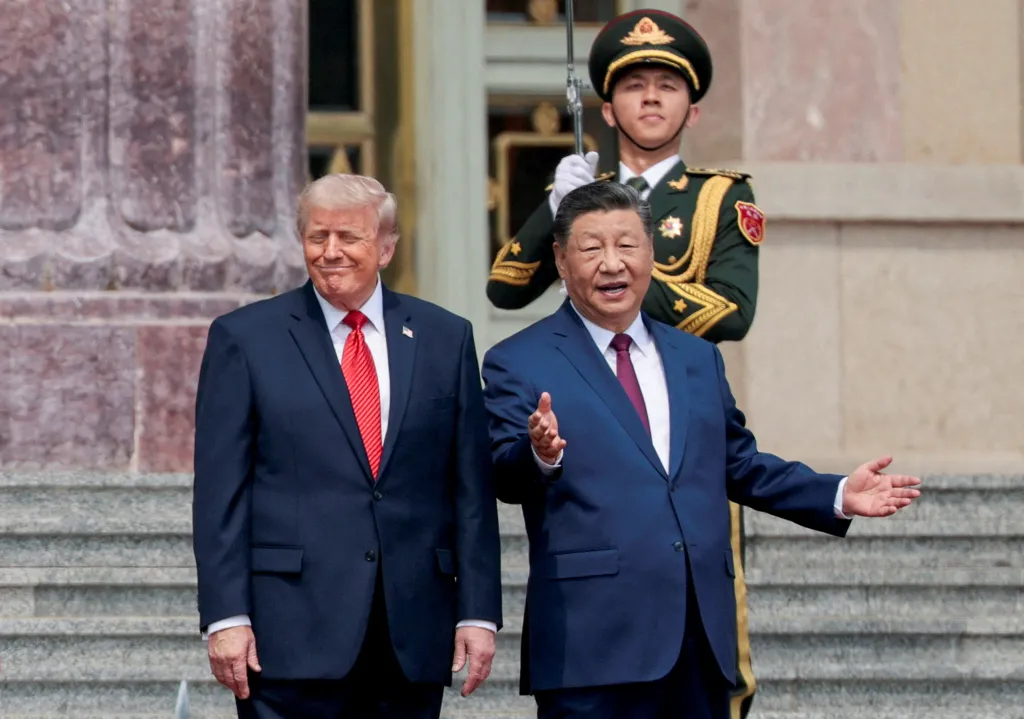 US President Donald Trump and Chinese President Xi Jinping stand together during a welcome ceremony, with a Chinese guard standing behind them.