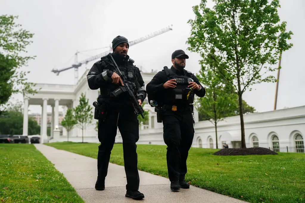 US Secret Service agents walk outside the White House after gunshots were heard near the complex on May 23, 2026.