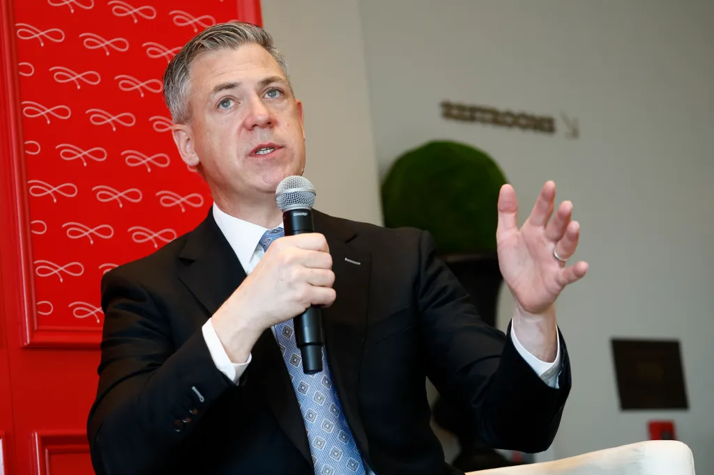 U.S. Senator Jim Banks speaking into a microphone.