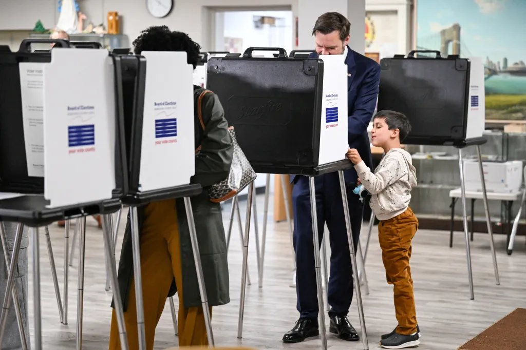U.S. Vice President JD Vance and his son Vivek vote at a polling station in Cincinnati, Ohio.