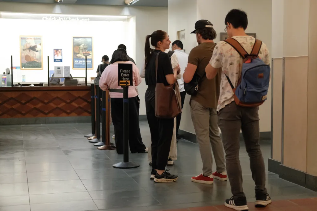 People waiting in line at the check-in/check-out counter of the Los Angeles Central Library.